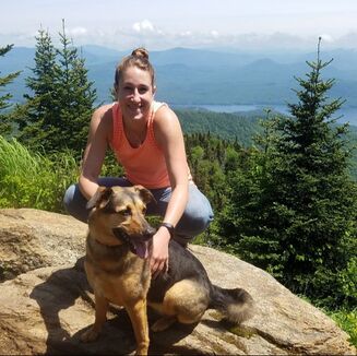 Picture: Mauri and her dog, Pip, posing at mountain overlook in the Adirondacks.